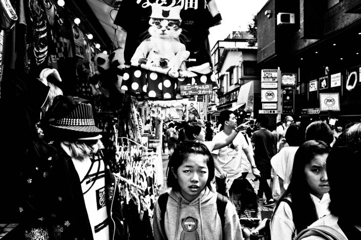 Japanese girl in Harajuku, Tokyo, including a cat t-shirt. Street Photography by Victor Borst