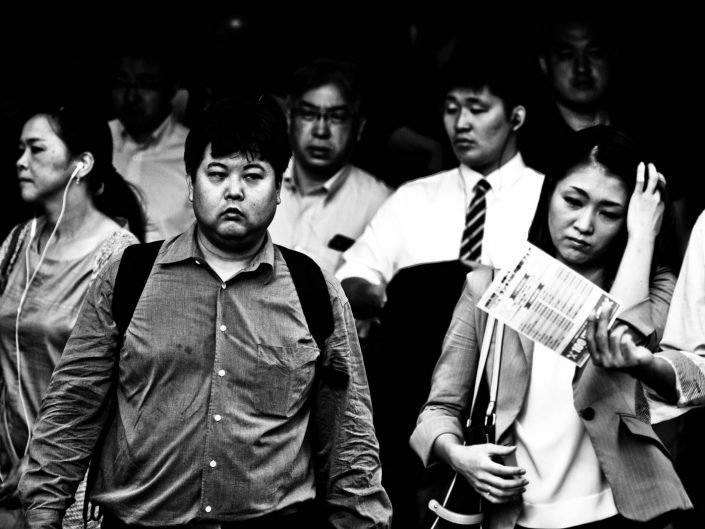 Shimbashi Tokyo Station crowd heading to work, not so happy. Street Photography by Victor Borst