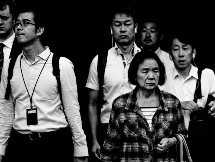 Shimbashi faces during rush hour heading for work. Street Photography by Victor Borst