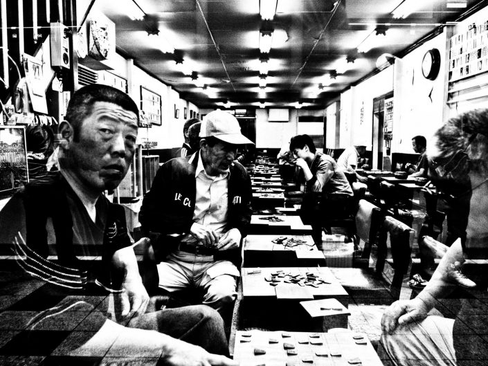 Japanese people playing the game Go in Osaka, Japanese chess. Street Photography by Victor Borst